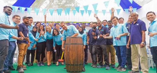 Tapping of the barrel at the grand opening of the new site of  MC-Bauchemie Malaysia in Semenyih, around 40 km southeast of Kuala Lumpur, with customers and employees.