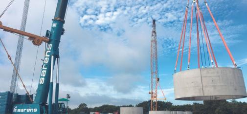 Placing the first ring on the foundation of a wind tower.