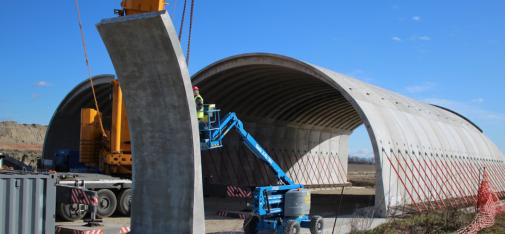 A green bridge under construction to help animals cross this road – likely to be very busy in the future – safe from danger.