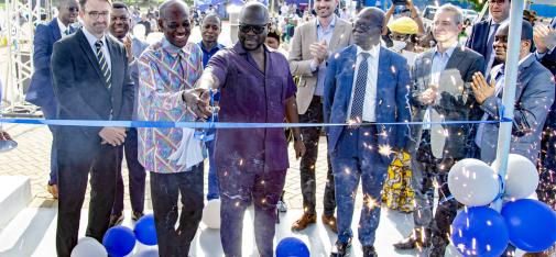 Francis Asenso-Boakye (centre), the Minister of Works and Housing in Ghana, cuts the blue ribbon and officially opens the new location of MC-Bauchemie Ghana in Accra. 