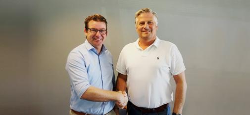 Handshake between the two managing directors of the newly founded company MC-Bauchemie Danmark ApS: Walter Devue (left) and Klaus Lebæk (right).