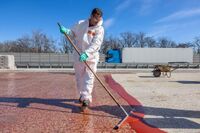 The concrete surface is pre-treated with MBC-VT 116 from MC-Bauchemie prior to scratch coat application.