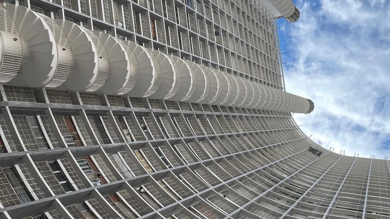 Impressive view of the building's spiral staircase from the bottom to the very top