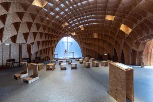 Inside, a unique place of reflection and prayer has been created, especially with the imposing wooden interior dome.