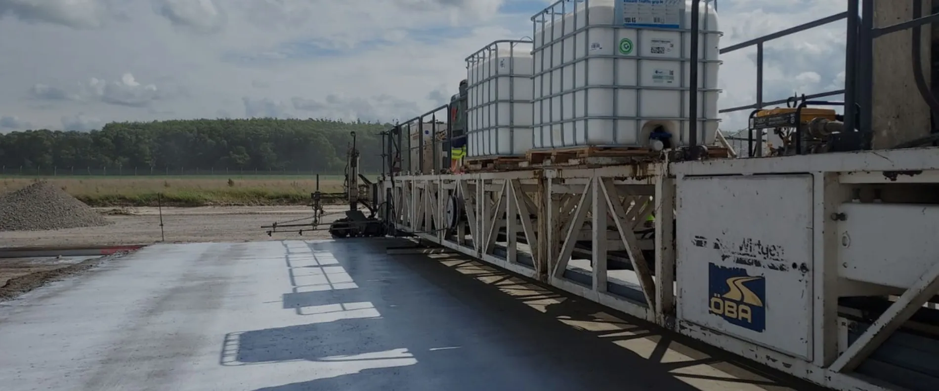 The concrete was placed using the slipform method and cured with Emcoril Traffic