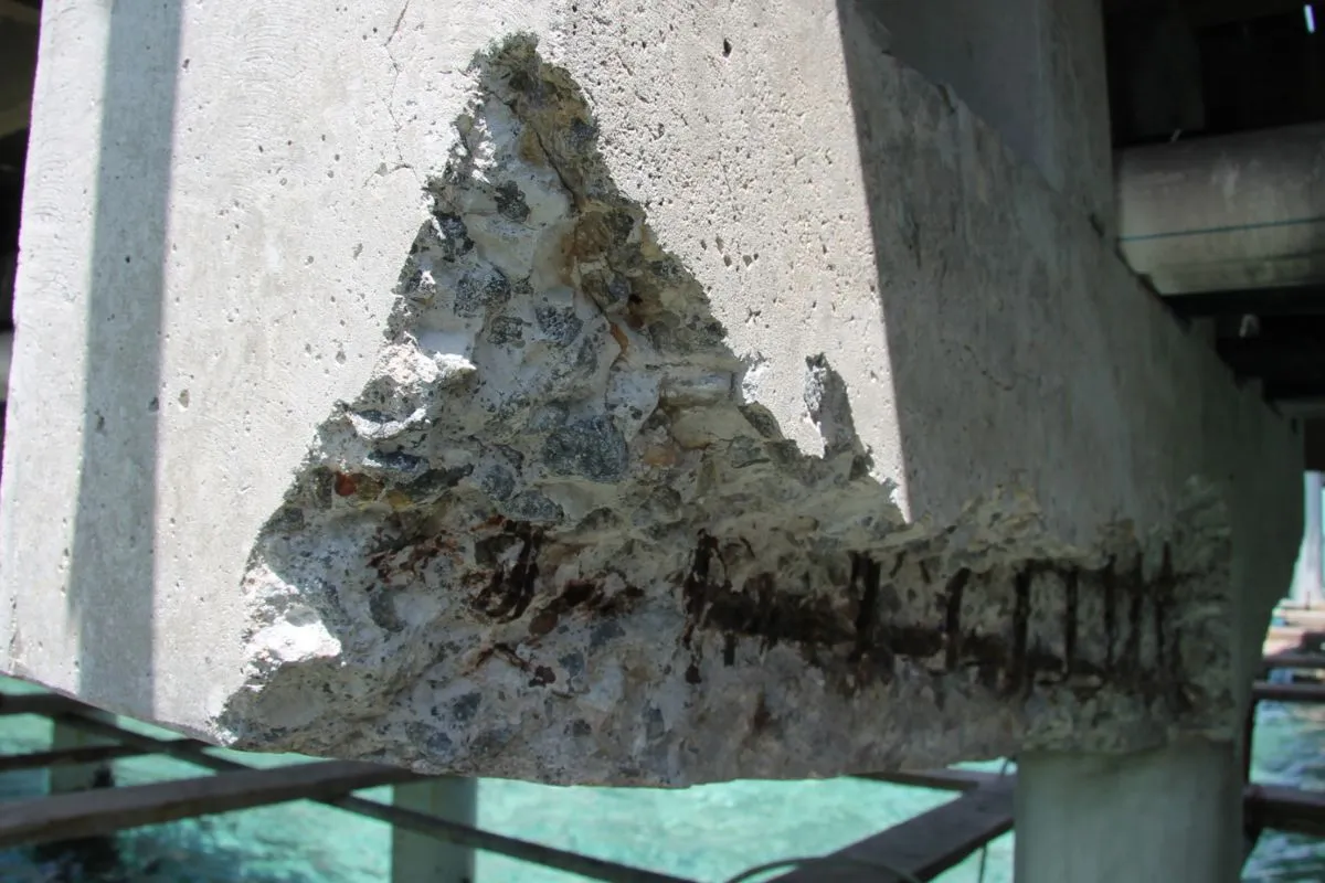 Close-up of the damaged concrete underside