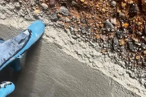 Close-up of a coated manhole