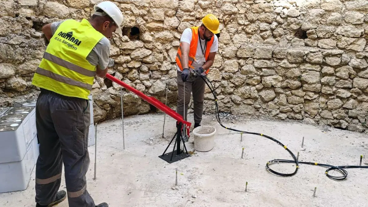 Contractors are carrying out precise drilling and grouting work to stabilise the tower’s foundation and secure the structure. 
