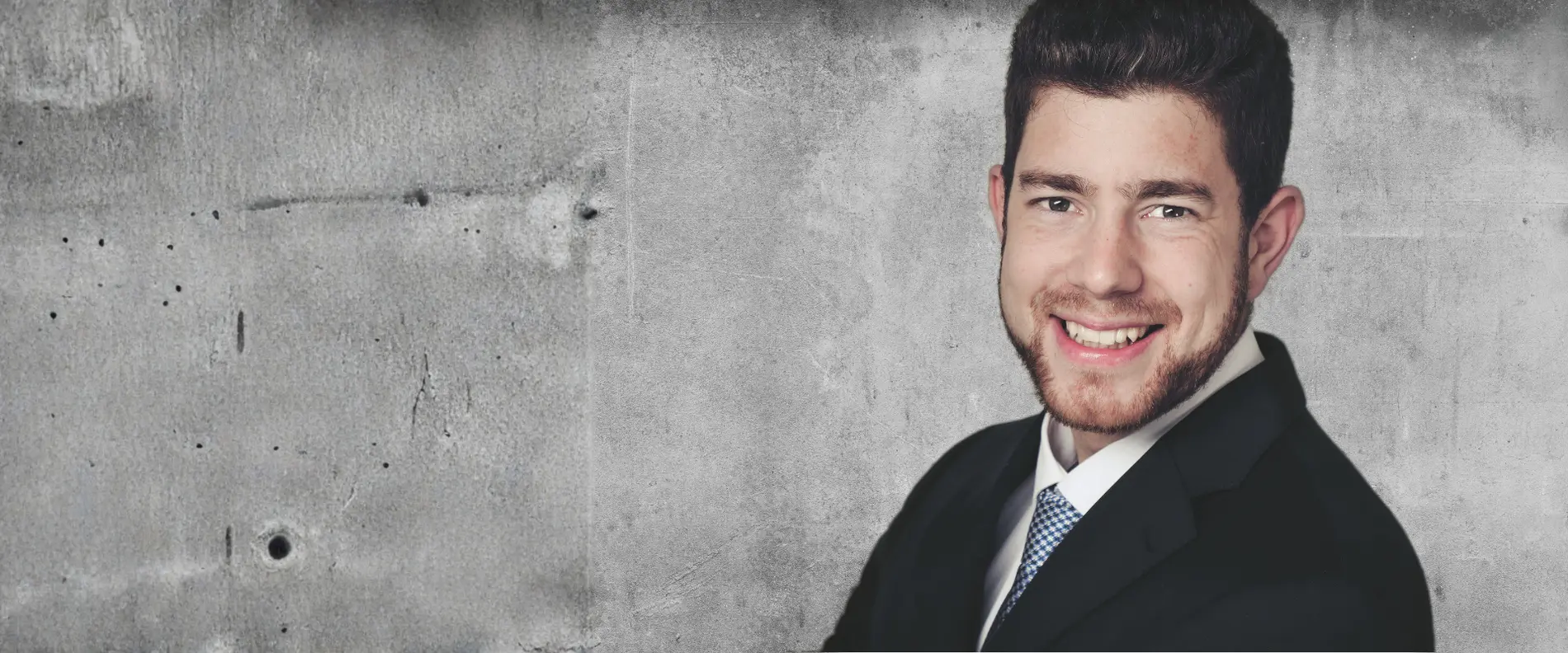 Dr Jonas Tendykc in front of a wall