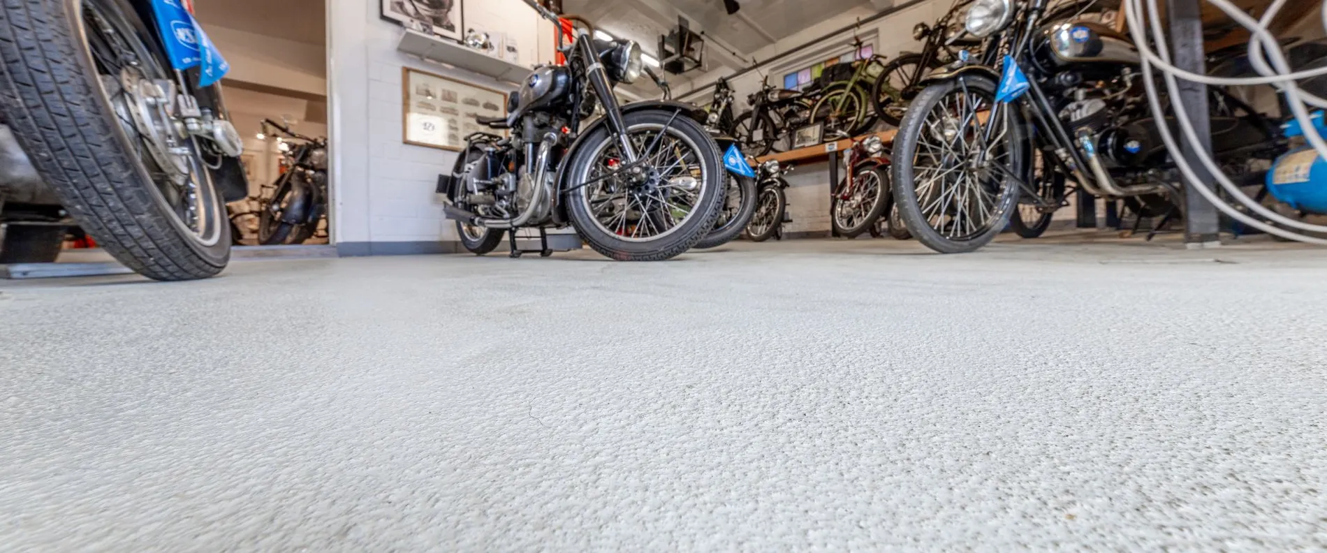 A view of a room filled with motorbikes.
