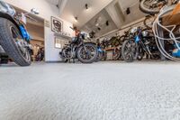 A view inside a room filled with motorbikes.