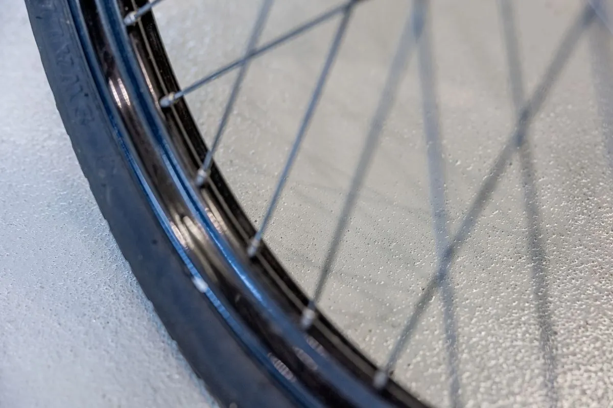 Close-up of a non-slip surface, with a tyre in the foreground.