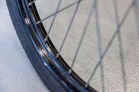Close-up of a non-slip surface, with a tyre in the foreground.