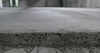 View of the freshly laid screed in the building shell. 