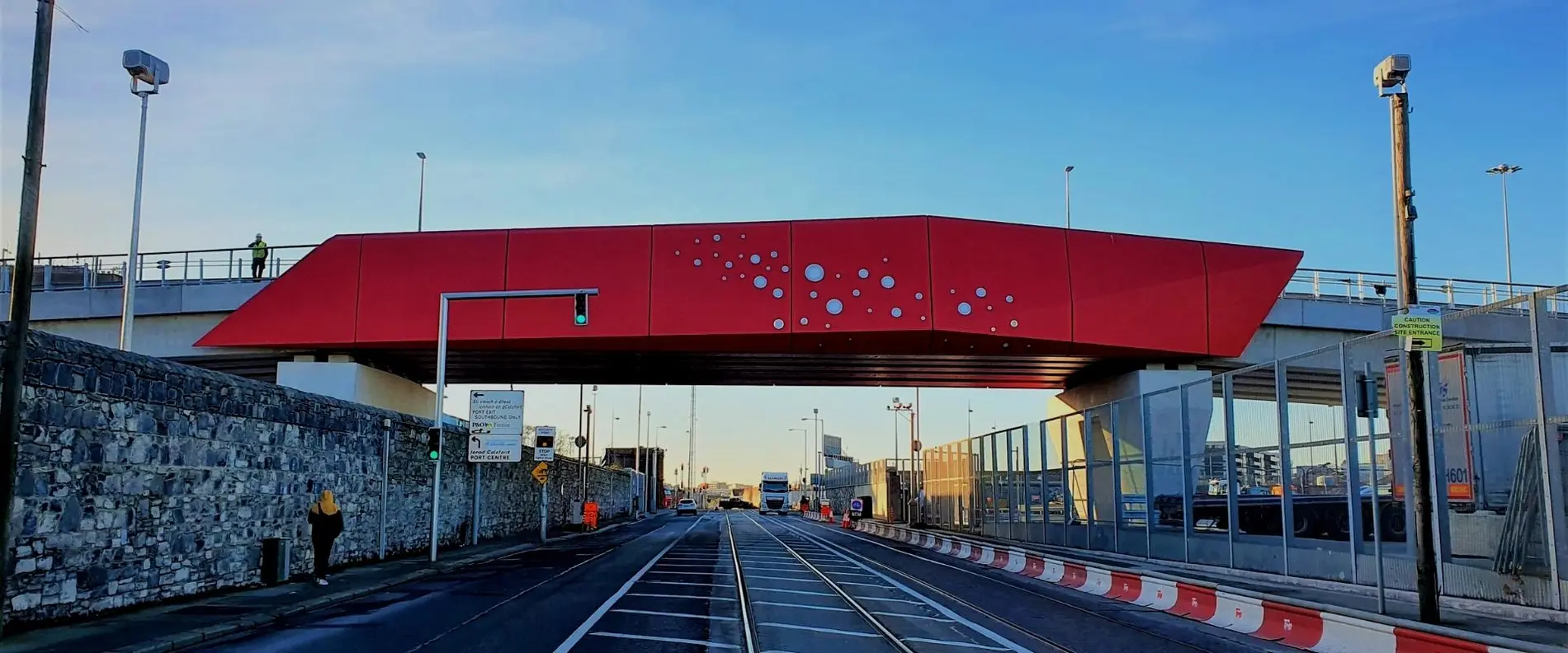 The bold red of the bridge matches the Poolbeg lighthouse in Dublin Bay.