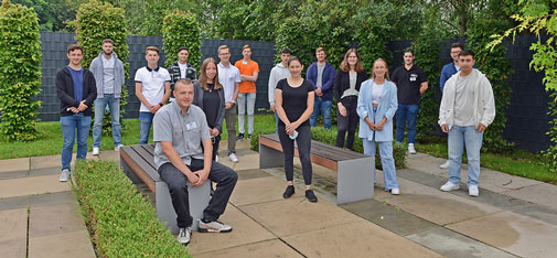 Traditional group picture of the new trainees in front of the MC-Bauchemie training centre in Bottrop.