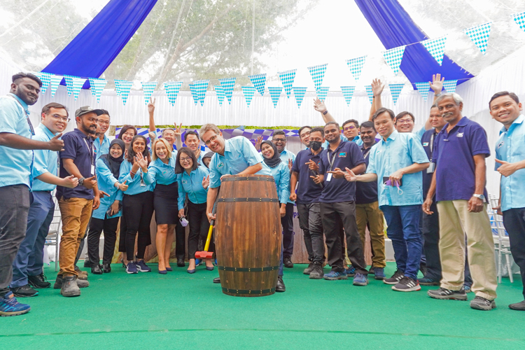 Tapping of the barrel at the grand opening of the new site of  MC-Bauchemie Malaysia in Semenyih, around 40 km southeast of Kuala Lumpur, with customers and employees.
