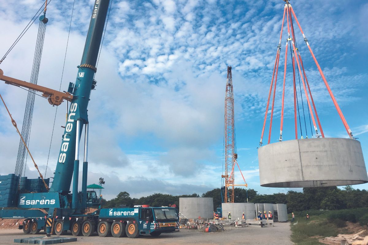 Placing the first ring on the foundation of a wind tower.